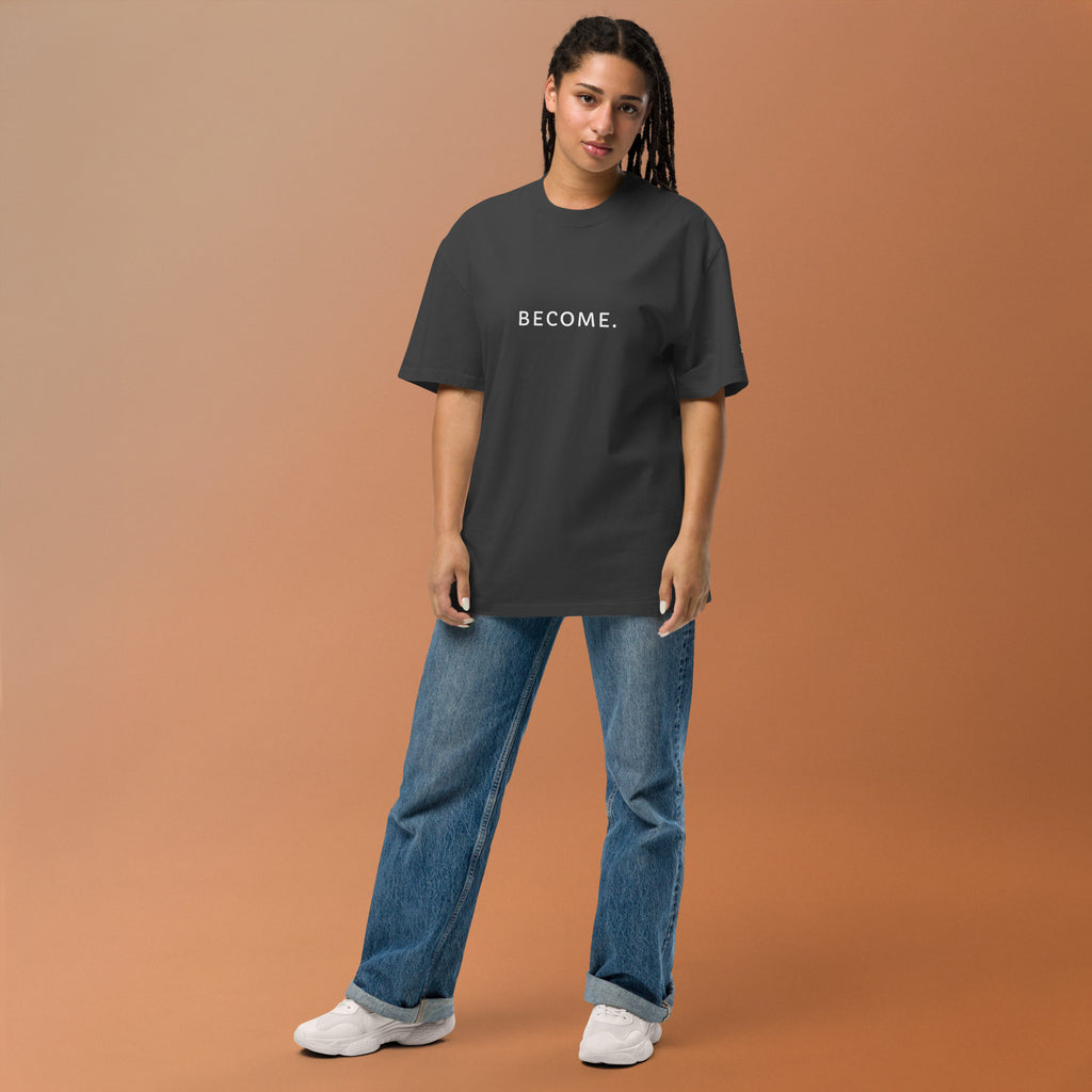 Model wearing the BECOME. Oversized Faded Tee in Faded Black, front view with BECOME. printed across the chest