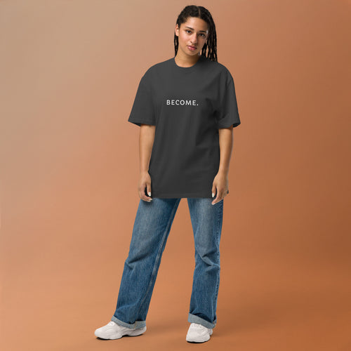 Model wearing the BECOME. Oversized Faded Tee in Faded Black, front view with BECOME. printed across the chest