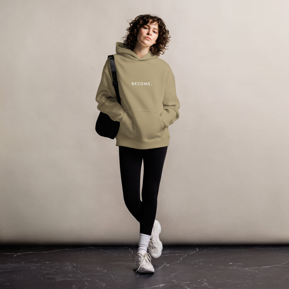 BECOME. Oversized Hoodie in Sand, front view with BECOME. printed across the chest